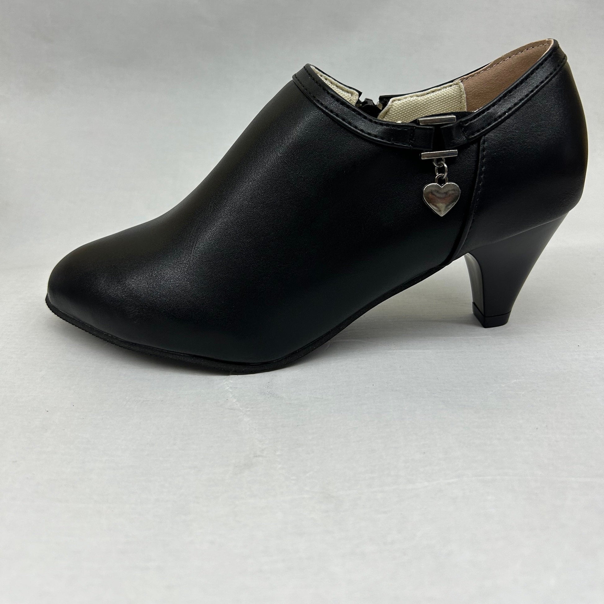 Stijlvolle zwarte pumps en enkellaarzen van hoogwaardig synthetisch leer met subtiele pailletten. Uitgebalanceerde mix van elegantie en comfort, perfect voor elke gelegenheid. Shop nu! afbeelding 4